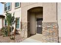 Front entry with security door and stone accents at 16800 E El Lago Blvd # 1028, Fountain Hills, AZ 85268