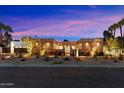 Brick home with desert landscaping, modern lighting, and inviting entryway at 3807 N 55Th Pl, Phoenix, AZ 85018