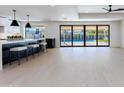 Modern kitchen with island and white and black cabinetry at 6759 E Aire Libre Ln, Scottsdale, AZ 85254