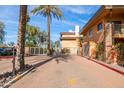 Gated entrance to the community with palm trees at 6940 E Cochise Rd # 1011, Paradise Valley, AZ 85253
