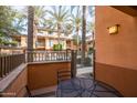 Private patio with table and chairs, overlooking pool at 6940 E Cochise Rd # 1011, Paradise Valley, AZ 85253