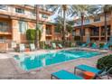 Inviting community pool with lounge chairs and spa at 6940 E Cochise Rd # 1011, Paradise Valley, AZ 85253
