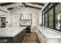 Modern kitchen with marble countertops, custom cabinetry, and a professional range at 7305 E Royal Palm Rd, Scottsdale, AZ 85258
