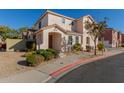 Two-story house with tan exterior, landscaped yard, and two-car garage at 832 E Stottler Dr, Gilbert, AZ 85296