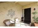 Inviting entryway with seating area and decorative wall art at 9711 E Mountain View Rd # 1545, Scottsdale, AZ 85258