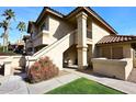 Attractive exterior of a two-story condo building with landscaping and walkway at 9711 E Mountain View Rd # 1545, Scottsdale, AZ 85258