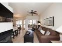 Spacious living room with access to a balcony and fireplace at 9711 E Mountain View Rd # 1545, Scottsdale, AZ 85258