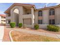 Condo building exterior with landscaping and walkway at 10610 S 48Th St # 2089, Phoenix, AZ 85044