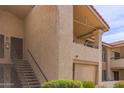 Exterior view of condo building staircase and entry at 10610 S 48Th St # 2089, Phoenix, AZ 85044