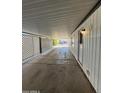 Covered carport with concrete flooring and side yard view at 120 N Val Vista Dr # 38, Mesa, AZ 85213