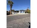 Mobile home with covered patio and desert landscaping at 120 N Val Vista Dr # 38, Mesa, AZ 85213