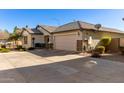 Single-story home with a two-car garage and desert landscaping at 1329 N Balboa --, Mesa, AZ 85205