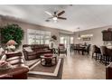 Spacious living room with leather furniture and tile floors at 1410 E Palm Beach Dr, Chandler, AZ 85249