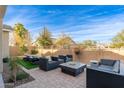Relaxing backyard patio with seating area and fire pit at 21062 E Via Del Sol --, Queen Creek, AZ 85142
