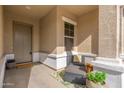 Inviting front porch with seating and potted plants at 21062 E Via Del Sol --, Queen Creek, AZ 85142