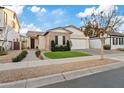 Single-story home with attached garage and well-manicured lawn at 22761 E Poco Calle St, Queen Creek, AZ 85142