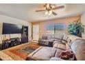 Spacious living room with sectional sofa and large TV at 2550 E Corona Ave, Phoenix, AZ 85040