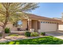Single-story home with a two-car garage and a landscaped front yard at 2663 S Springwood Blvd # 311, Mesa, AZ 85209