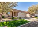 Single-story home with a two-car garage, and a well-maintained front yard at 2663 S Springwood Blvd # 311, Mesa, AZ 85209