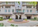 Modern building with water feature and manicured landscaping at 3801 N Goldwater Blvd # 204, Scottsdale, AZ 85251