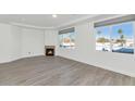 Bright living room with hardwood floors, fireplace and city views at 3801 N Goldwater Blvd # 204, Scottsdale, AZ 85251