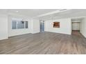 Spacious living room with hardwood floors and fireplace at 3801 N Goldwater Blvd # 204, Scottsdale, AZ 85251