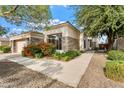 Single-story home with stone accents and landscaped front yard at 3830 E Carter Dr, Phoenix, AZ 85042