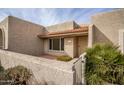 Light tan stucco condo with a charming entryway and nicely kept landscaping at 7153 N Via De Paesia --, Scottsdale, AZ 85258