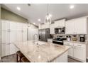 Bright kitchen boasts granite countertops and ample cabinetry at 9333 E University Dr # 110, Mesa, AZ 85207