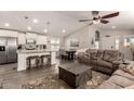 Open concept kitchen and living area with island and seating at 9333 E University Dr # 110, Mesa, AZ 85207
