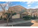 Two-story home with neutral exterior, two-car garage, and landscaping at 9839 E Theia Dr, Mesa, AZ 85212