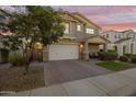 Two-story home with neutral exterior, two-car garage, and landscaping at 9839 E Theia Dr, Mesa, AZ 85212