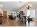 Light and airy living room with a fireplace and hardwood floors at 10869 W Alex Ave, Sun City, AZ 85373