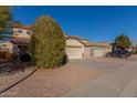 Two-story house with a large driveway and desert landscaping at 11640 W Duran Ave, Youngtown, AZ 85363