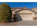 Two-story house with a large driveway and desert landscaping at 11640 W Duran Ave, Youngtown, AZ 85363