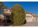 Two-story house with a large driveway and desert landscaping at 11640 W Duran Ave, Youngtown, AZ 85363