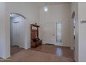 Bright and spacious entry with tile flooring and coat rack at 1227 W Delmonte Dr, Casa Grande, AZ 85122