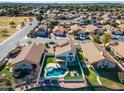 Aerial view of home with pool and backyard, situated near a lake in a neighborhood at 1610 W Maplewood St, Chandler, AZ 85286