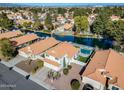 Aerial view of house on the lake with private pool and backyard at 1610 W Maplewood St, Chandler, AZ 85286