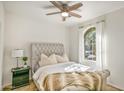 Bedroom with plush bed, nightstand, and large window at 1693 E Dogwood Ln, Gilbert, AZ 85295