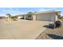 View of the home's front and driveway at 19619 N Signal Butte Cir, Sun City, AZ 85373