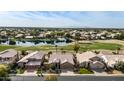 Community overview featuring lake and golf course at 21964 N 59Th Ln, Glendale, AZ 85310