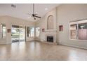 Living room with fireplace, high ceilings and access to backyard at 21964 N 59Th Ln, Glendale, AZ 85310