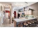 L-shaped kitchen with light wood cabinets and granite counters at 270 E 13Th Ave, Apache Junction, AZ 85119