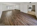 Spacious living area with wood-look floors and an open concept floor plan at 3334 S Elm St, Tempe, AZ 85282