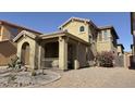 Two-story home with front porch and desert landscaping at 3948 E Morelos St, Gilbert, AZ 85295