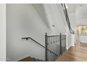 Modern staircase with metal railing and wood flooring at 421 W 6Th St # 1009, Tempe, AZ 85281