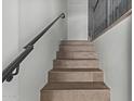 Modern staircase with dark wood treads and metal railing at 421 W 6Th St # 1009, Tempe, AZ 85281