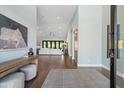 Bright and airy entryway with wood floors and a view to the living room at 4602 E Arcadia Ln, Phoenix, AZ 85018