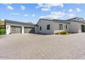 Two-car garage with modern wood and glass doors at 4602 E Arcadia Ln, Phoenix, AZ 85018